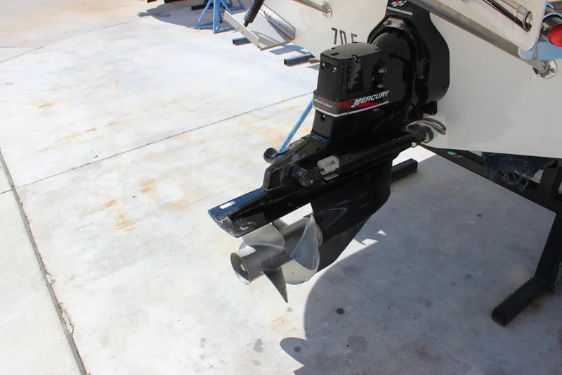 Slide: The Image of 2003 Wellcraft Martinique 2600 boat with Mercury outdrive on concrete surface. - 10