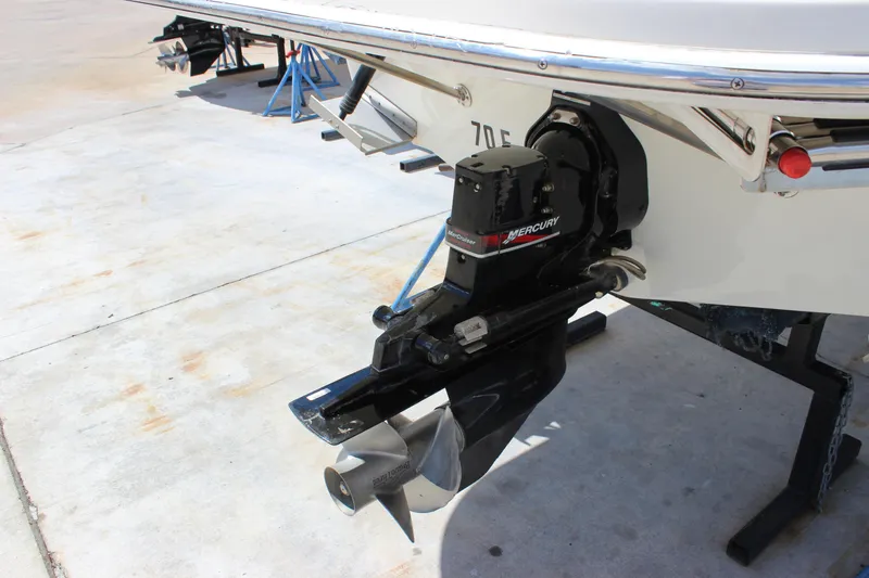 Slide: The Image of 2003 Wellcraft Martinique 2600 boat with Mercury outboard motor on a trailer. - 5