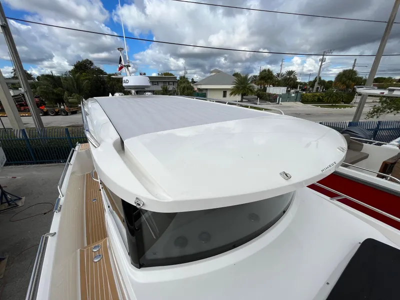 Slide: The Image of Nimbus Commuter 9 #136, 2024 model, showcasing sleek design and rooftop details. - 15