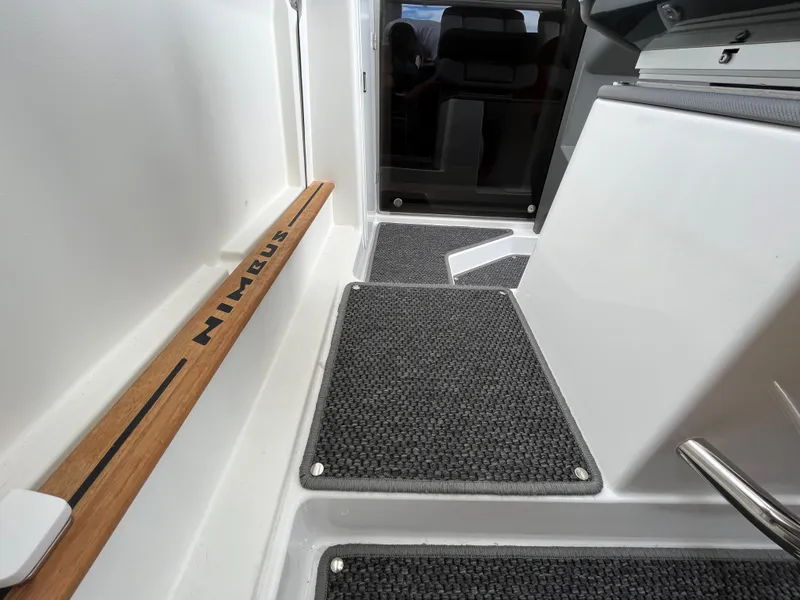 Slide: The Image of 2024 Nimbus Commuter 9 #136 interior with non-slip flooring and wooden trim. - 25