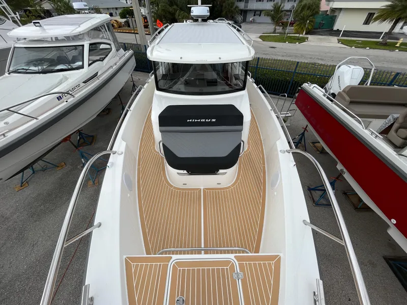 Slide: The Image of 2024 Nimbus Commuter 9 #136 boat with teak deck and white cabin. - 28