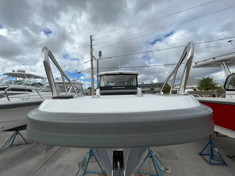 Slide: The Image of 2024 Nimbus Commuter 9 #136 boat on stands under cloudy sky. - 32