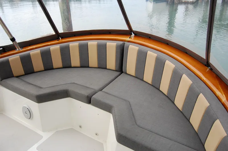 Slide: The Image of 1981 Willard Marine Pilot House Trawler with cushioned seating in the cabin. - 13