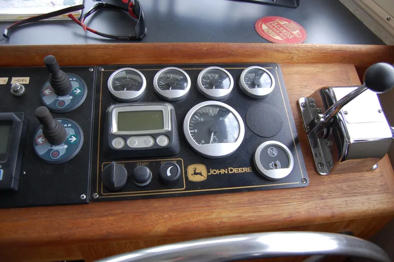 Slide: The Image of Control panel of a 1981 Willard Marine Pilot House Trawler with John Deere gauges. - 24