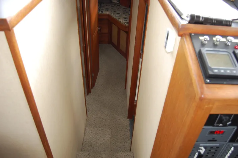 Slide: The Image of Interior of 1981 Willard Marine Pilot House Trawler, featuring hallway and control panel. - 29