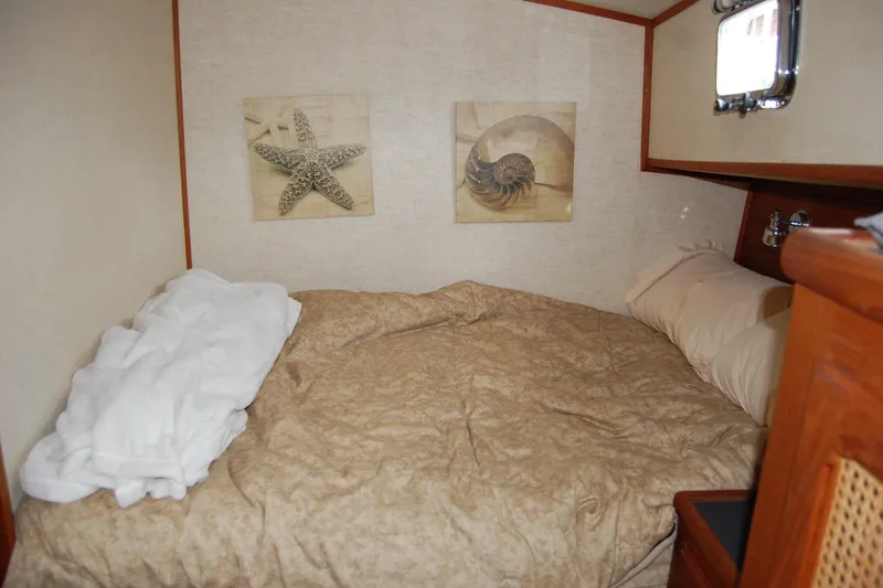Slide: The Image of Cozy cabin interior of 1981 Willard Marine Pilot House Trawler with nautical decor. - 35