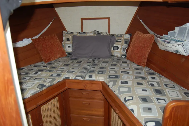 Slide: The Image of Cozy cabin interior of 1981 Willard Marine Pilot House Trawler with patterned bedding. - 37