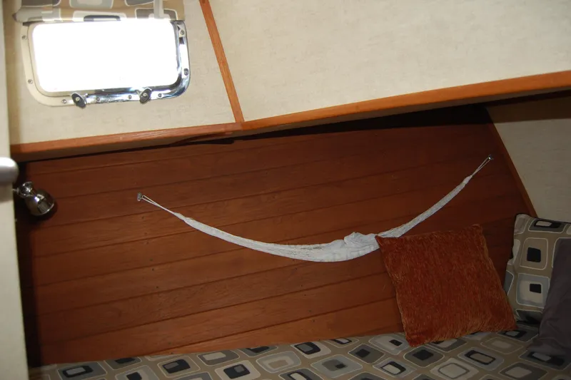 Slide: The Image of Cozy cabin interior of 1981 Willard Marine Pilot House Trawler with cushions and hammock. - 38