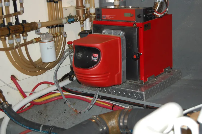 Slide: The Image of Engine room of 1981 Willard Marine Pilot House Trawler with red heating unit. - 41