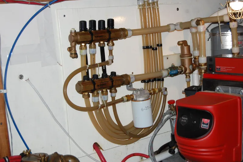Slide: The Image of Engine room of 1981 Willard Marine Pilot House Trawler with complex piping system. - 42