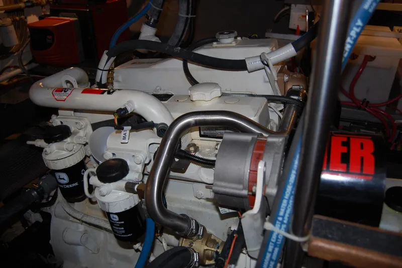 Slide: The Image of Engine room of a 1981 Willard Marine Pilot House Trawler, showcasing mechanical components. - 43