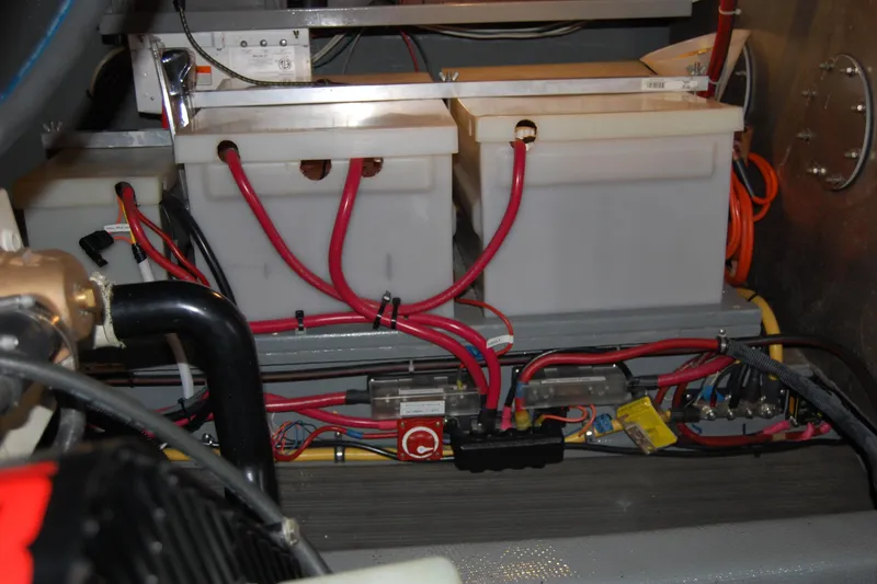 Slide: The Image of Engine room of 1981 Willard Marine Pilot House Trawler with battery setup and wiring. - 44