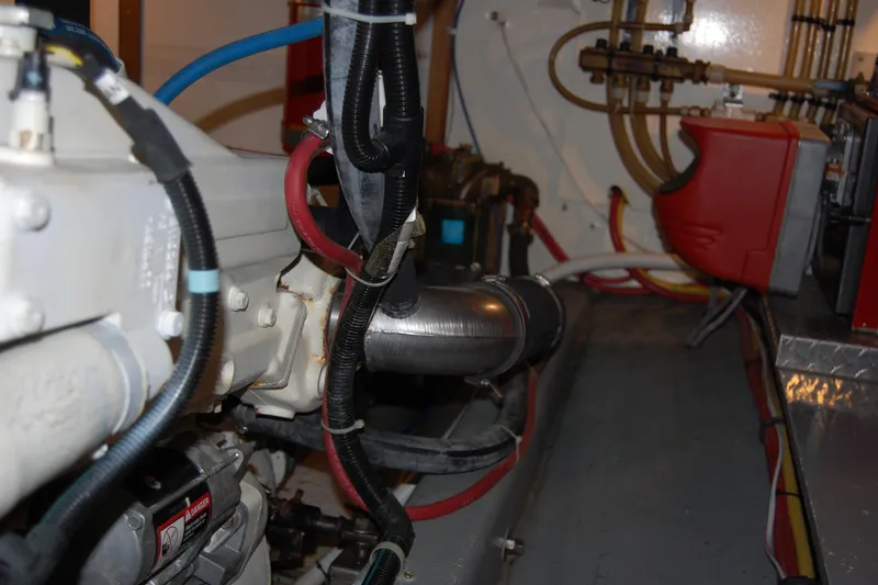 Slide: The Image of Engine room of 1981 Willard Marine Pilot House Trawler with visible pipes and machinery. - 47