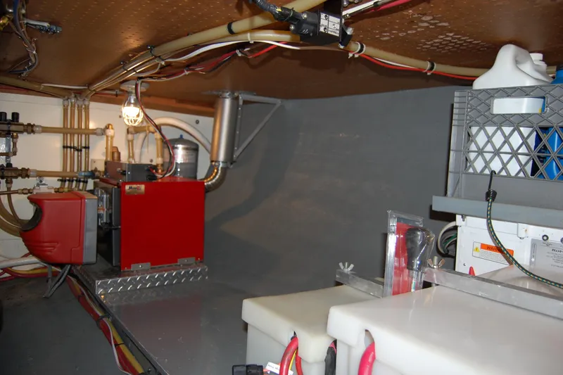 Slide: The Image of Engine room of 1981 Willard Marine Pilot House Trawler with equipment and wiring. - 50