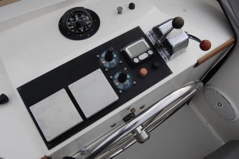 Slide: The Image of Control panel of a 1981 Willard Marine Pilot House Trawler with navigation instruments. - 57
