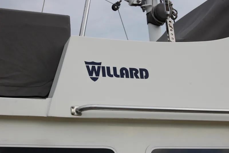 Slide: The Image of 1981 Willard Marine Pilot House Trawler with logo and railing detail. - 7
