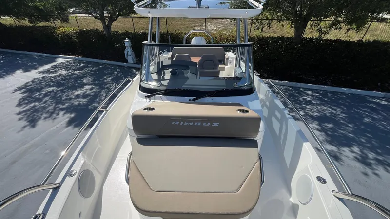 Slide: The Image of 2024 Nimbus Tender 8 #314 boat with cushioned seating and sleek design. - 19
