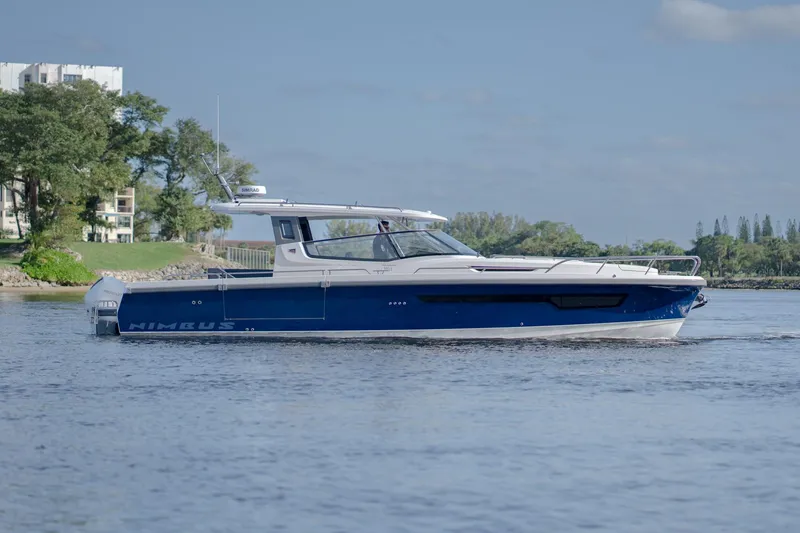 The Image of 2024 Nimbus Weekender 11 #20 luxury boat on a serene waterway. - 0