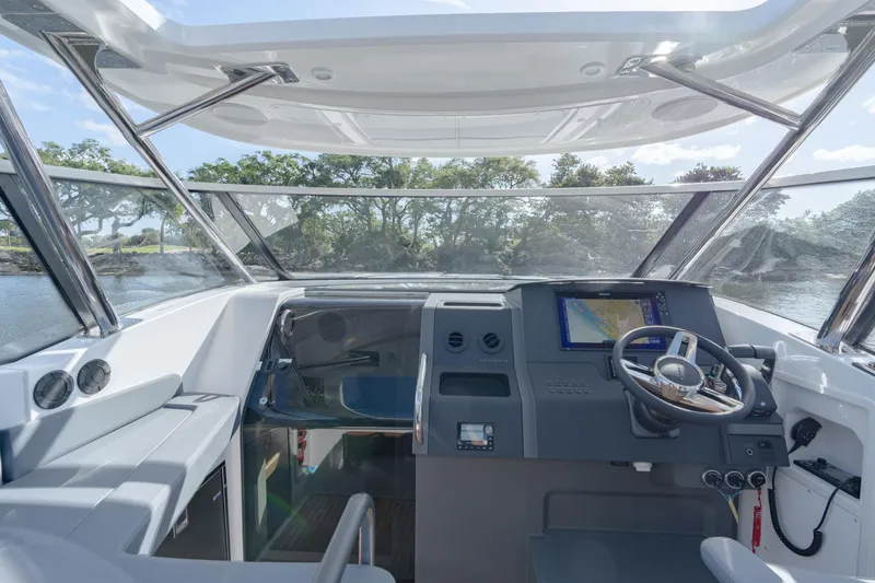 Slide: The Image of Interior helm of 2024 Nimbus Weekender 11 #20 boat with modern navigation system. - 11