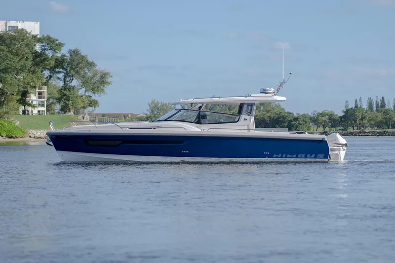 Slide: The Image of 2024 Nimbus Weekender 11 #20 boat cruising on a calm river. - 3