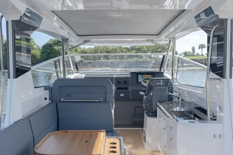 Slide: The Image of 2024 Nimbus Weekender 11 #20 interior with modern seating and navigation area. - 7