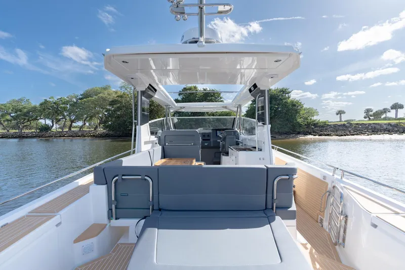 Slide: The Image of 2024 Nimbus Weekender 11 #20 boat interior with seating and water view. - 8