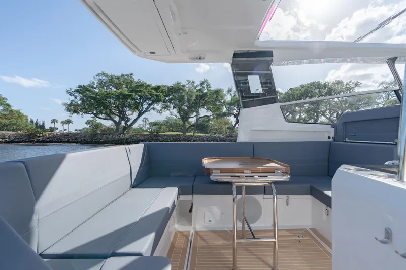 Slide: The Image of Luxurious seating area on the 2024 Nimbus Weekender 11 #20 boat. - 9