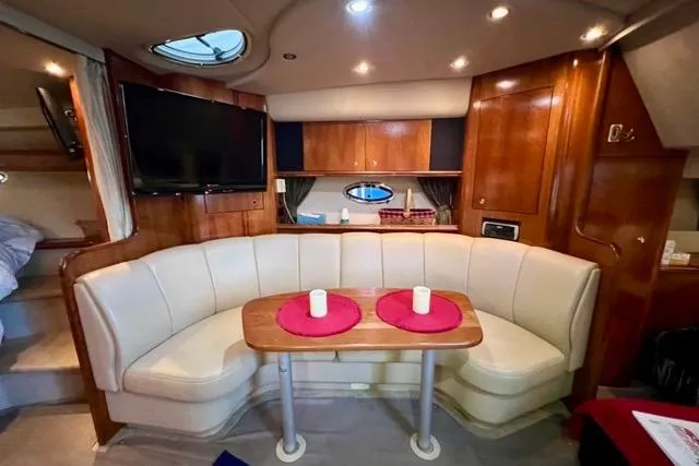 Slide: The Image of Luxurious interior of 2003 Cruisers Yachts 3772 Express with plush seating and elegant wood finishes. - 19