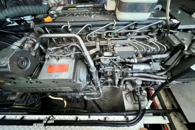 Slide: The Image of Engine of 2003 Cruisers Yachts 3772 Express, showcasing intricate mechanical components. - 27