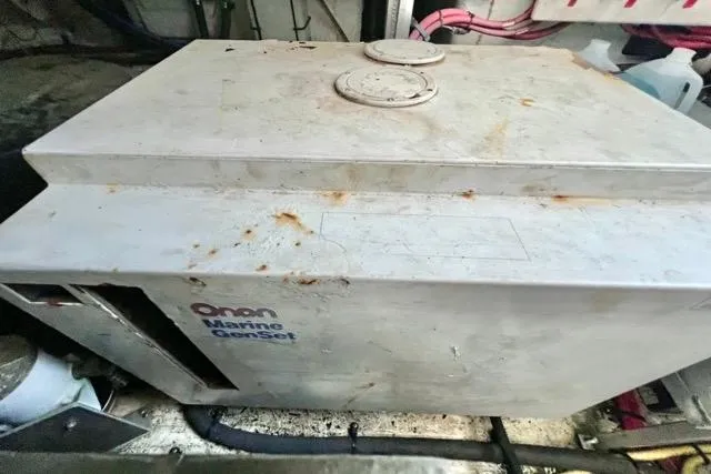 Slide: The Image of 2003 Cruisers Yachts 3772 Express Onan Marine GenSet in engine compartment. - 33