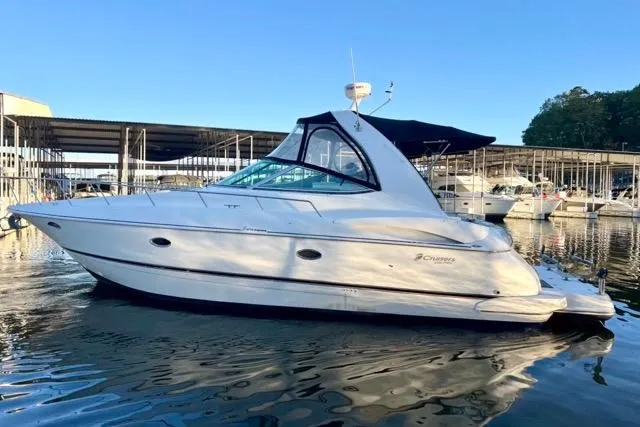 Slide: The Image of 2003 Cruisers Yachts 3772 Express docked in marina, side view. - 4