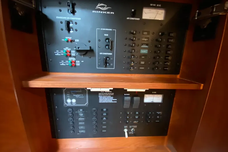 Slide: The Image of Electrical control panel of a 2008 Rinker 350 Express Cruiser boat. - 32