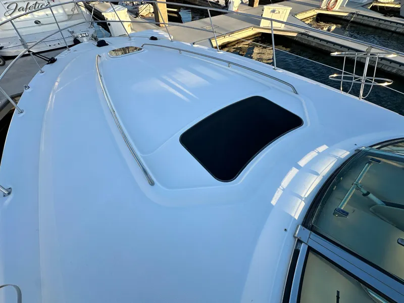 Slide: The Image of 2005 Sea Ray 420 Sundancer yacht deck with sunroof at marina. - 13