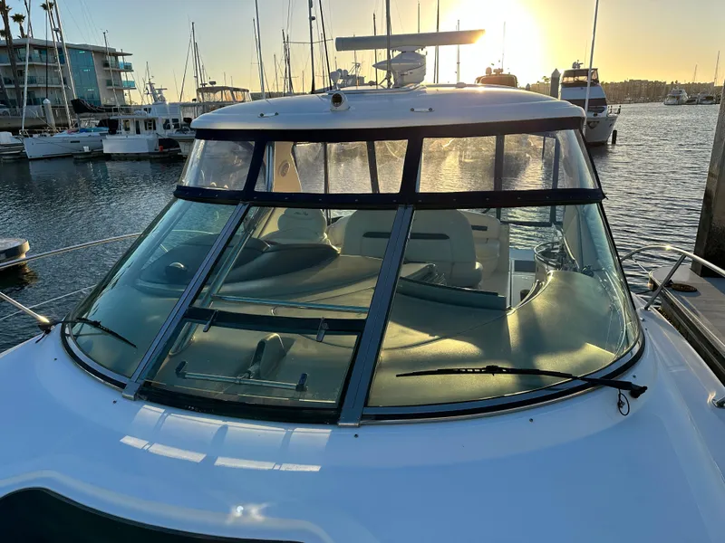 Slide: The Image of 2005 Sea Ray 420 Sundancer yacht docked at marina during sunset. - 14