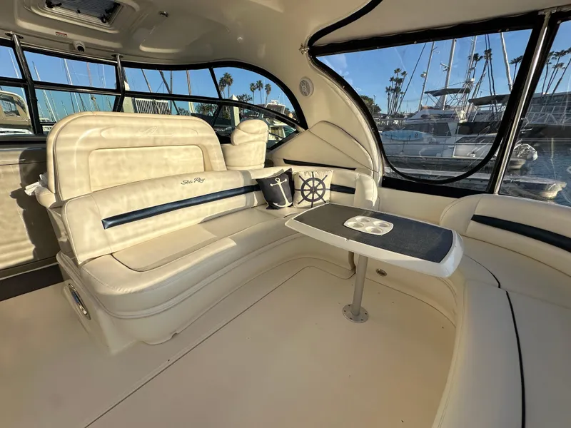 Slide: The Image of Luxurious interior of 2005 Sea Ray 420 Sundancer yacht with plush seating and table. - 16