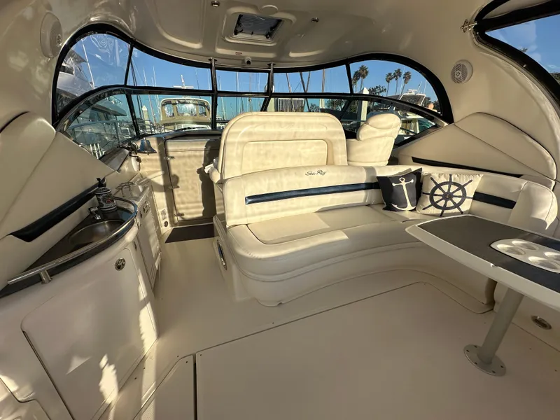 Slide: The Image of Luxurious interior of 2005 Sea Ray 420 Sundancer yacht with plush seating and nautical decor. - 19