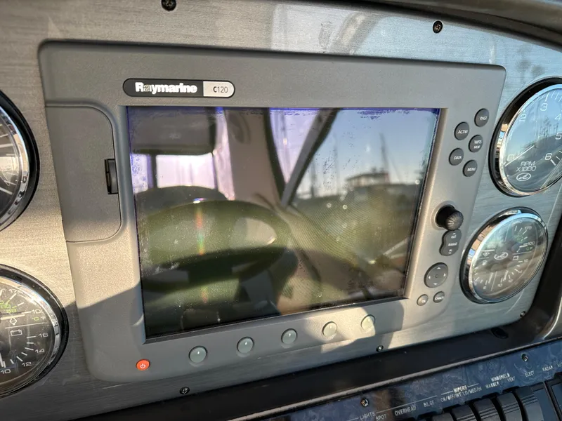 Slide: The Image of Raymarine C120 navigation system on 2005 Sea Ray 420 Sundancer dashboard. - 23