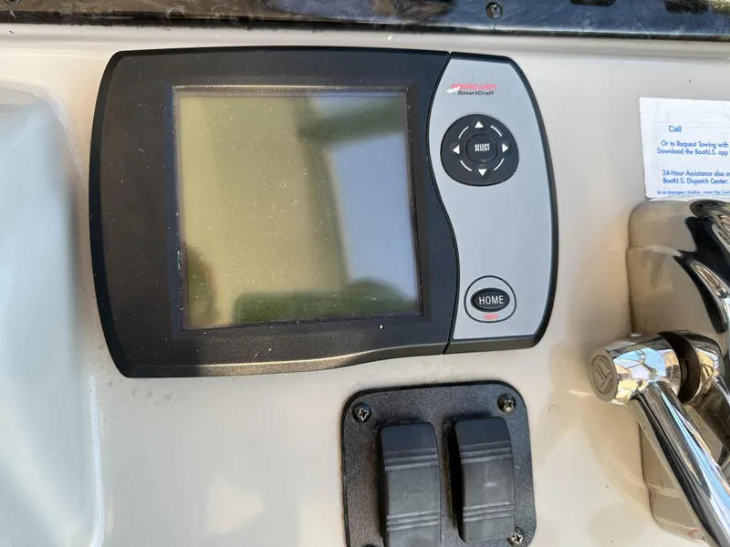 Slide: The Image of Control panel of a 2005 Sea Ray 420 Sundancer boat. - 24