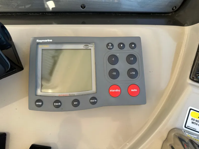 Slide: The Image of Raymarine control panel on 2005 Sea Ray 420 Sundancer yacht dashboard. - 25