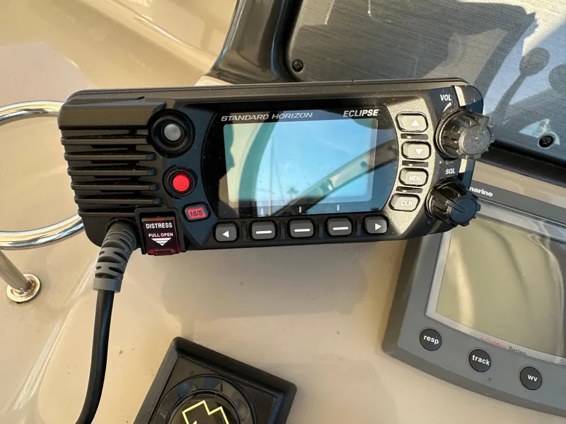 Slide: The Image of Standard Horizon Eclipse radio on 2005 Sea Ray 420 Sundancer boat dashboard. - 27