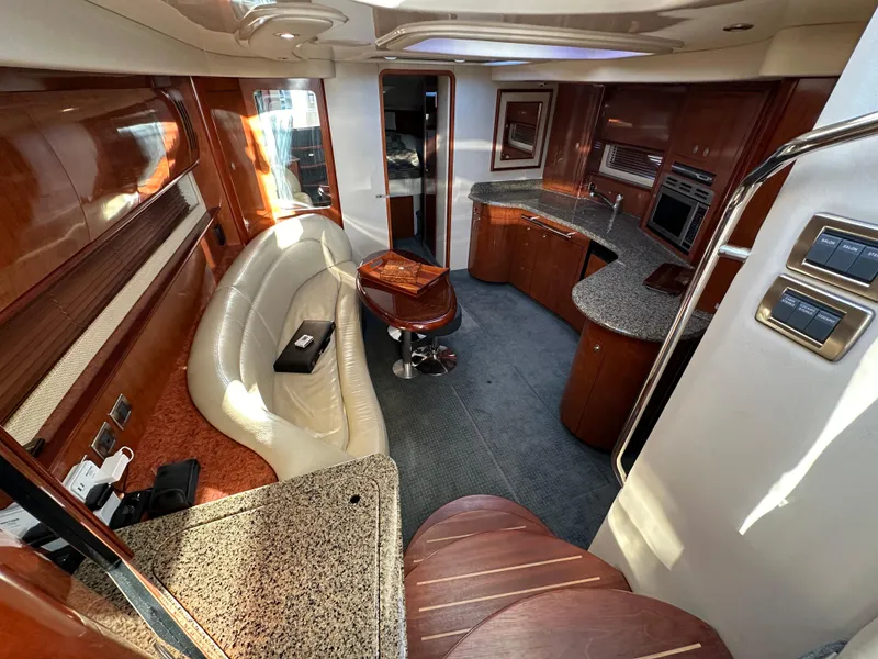Slide: The Image of Luxurious 2005 Sea Ray 420 Sundancer yacht interior with elegant wood and leather finishes. - 30