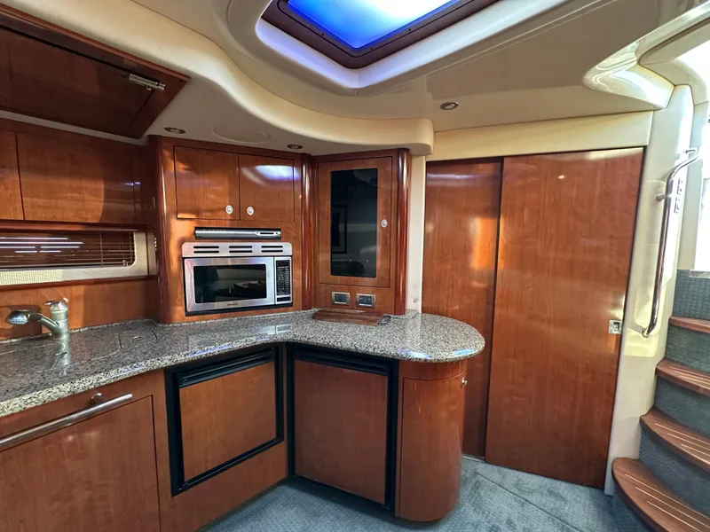 Slide: The Image of Luxurious 2005 Sea Ray 420 Sundancer yacht interior with modern kitchen amenities. - 34