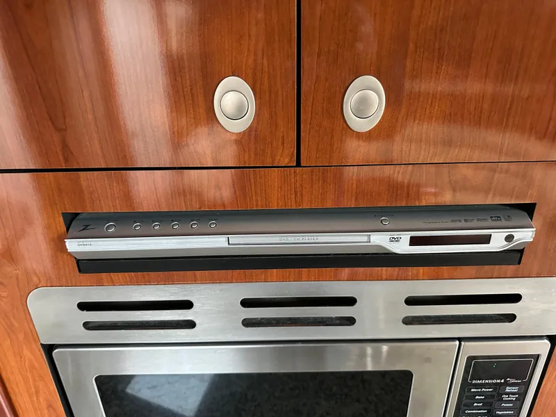 Slide: The Image of DVD player and microwave in 2005 Sea Ray 420 Sundancer yacht kitchen. - 45