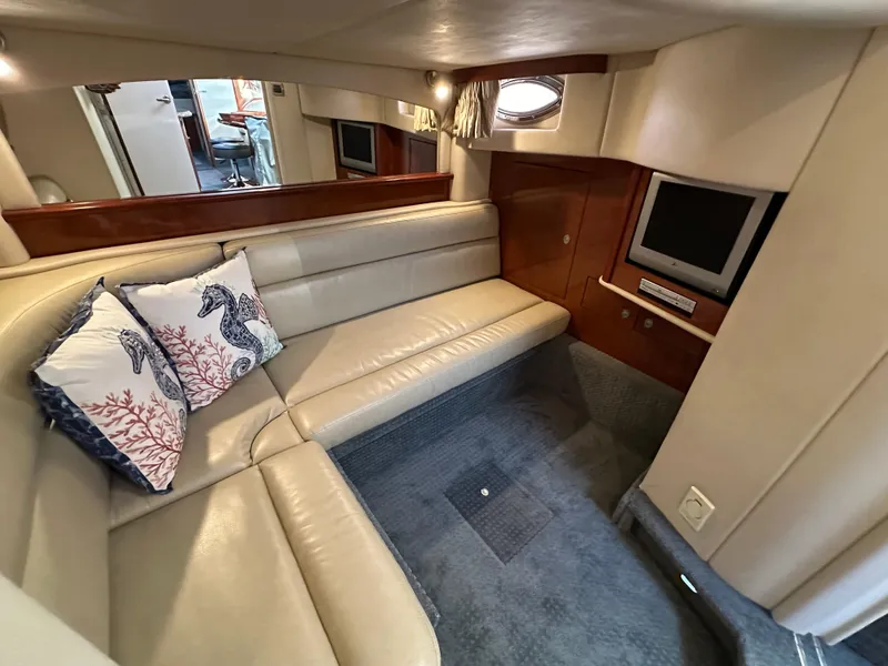 Slide: The Image of Luxurious 2005 Sea Ray 420 Sundancer cabin with plush seating and TV. - 47