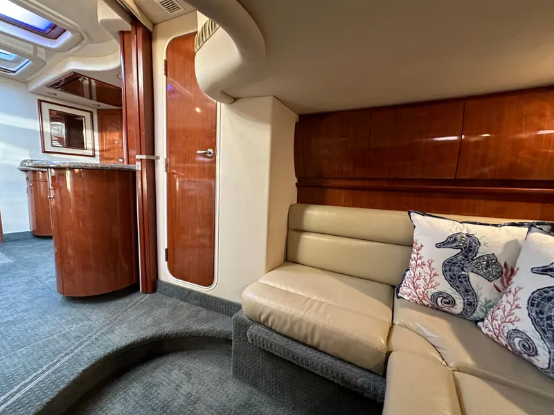 Slide: The Image of Luxurious 2005 Sea Ray 420 Sundancer interior with plush seating and elegant wood finishes. - 49
