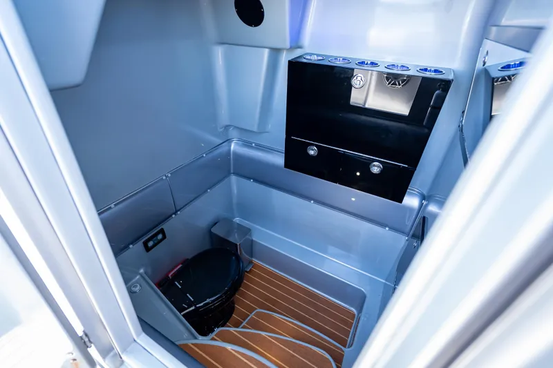 Slide: The Image of Interior of 2012 Yellowfin 39 boat bathroom with modern fixtures and wood flooring. - 11