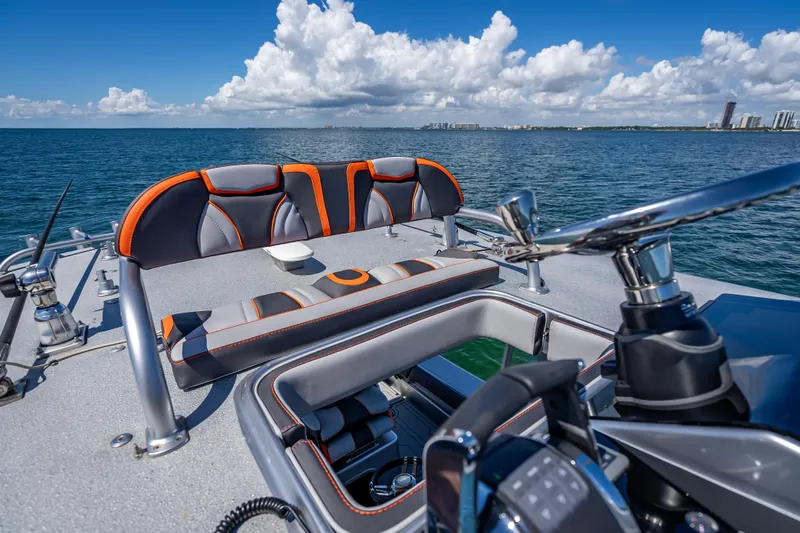 Slide: The Image of 2012 Yellowfin 39 boat interior with sleek seating and ocean view. - 17