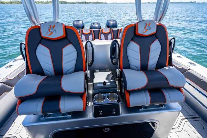 Slide: The Image of 2012 Yellowfin 39 boat interior with stylish seats and ocean backdrop. - 19