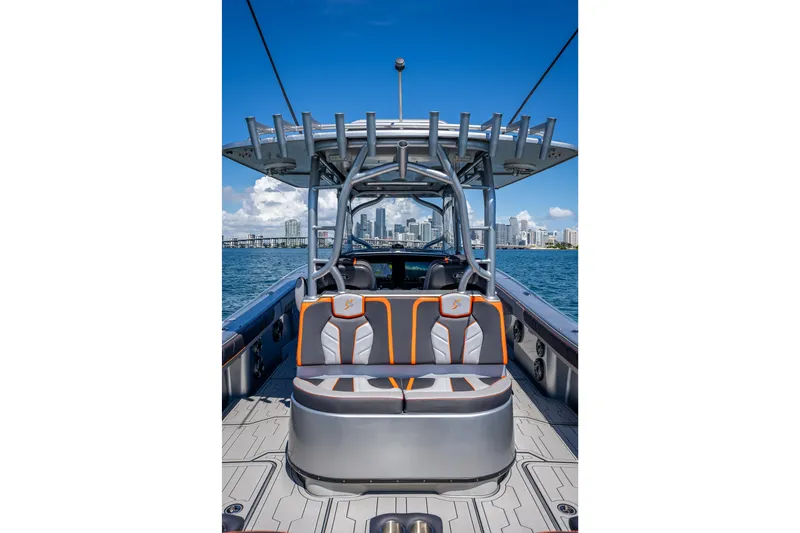 Slide: The Image of 2012 Yellowfin 39 boat with stylish seating, city skyline in background. - 20