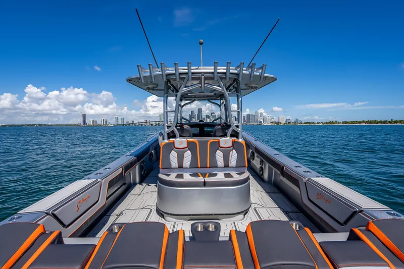 Slide: The Image of 2012 Yellowfin 39 boat on water with city skyline in background. - 26